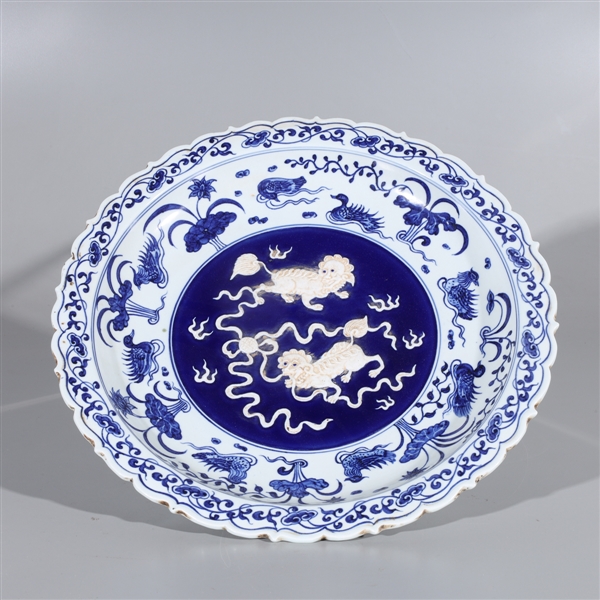 Appraisal: Chinese blue and white porcelain charger with lions and flaming