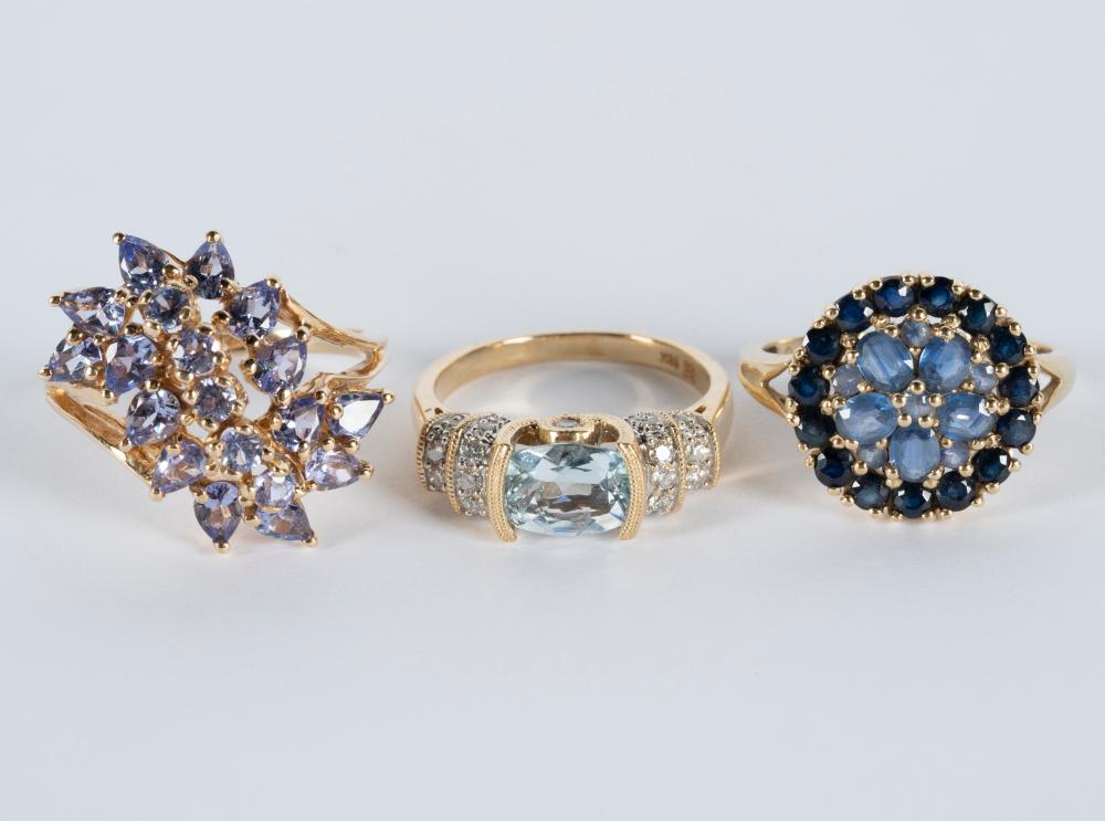 Appraisal: THREE ASSORTED YELLOW GOLD BLUE-STONE RINGSone karat yellow gold ring