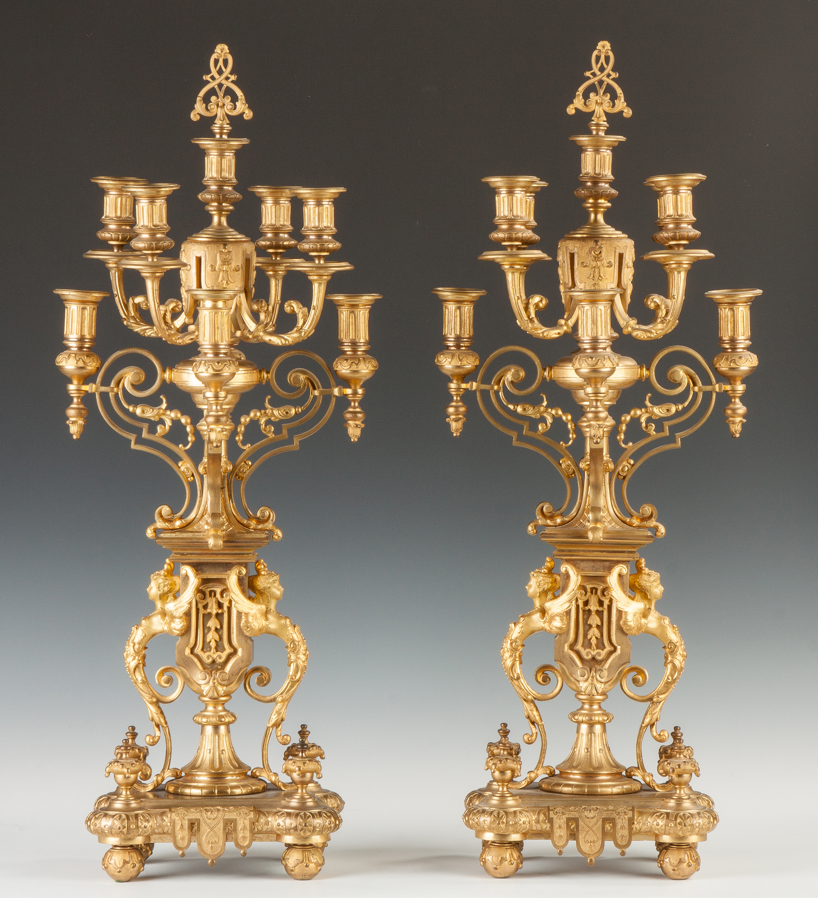 Appraisal: French Gilt Bronze Seven Light Candelabras th cent With winged