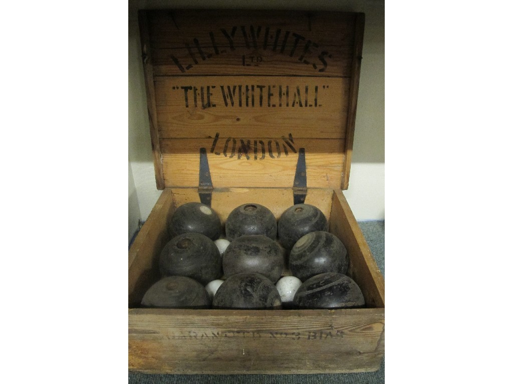 Appraisal: Nine bowling balls and jacks in wooden export box Provenance