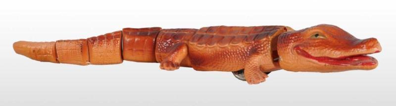 Appraisal: Celluloid Crocodile Wind-Up Toy Description Pre-war Japanese Toy has a