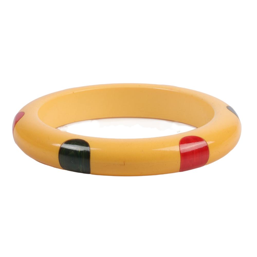 Appraisal: BAKELITE CREAM SIX-DOT BANGLE BRACELET WITH GREEN AND RED DOTS