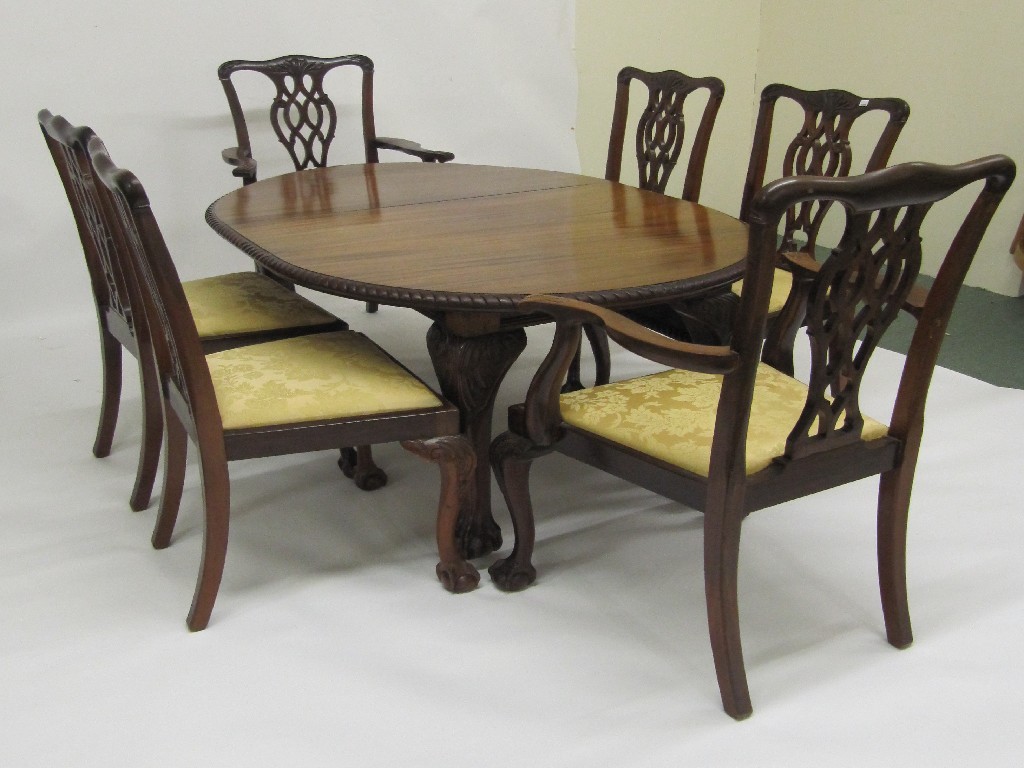 Appraisal: A reproduction Chippendale style mahogany extending dining table the oval