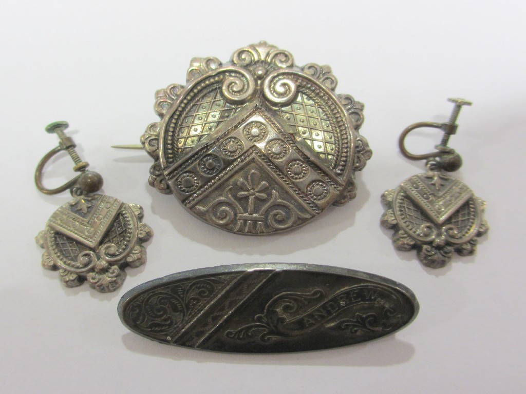 Appraisal: Two Victorian silver brooches one with matching earrings