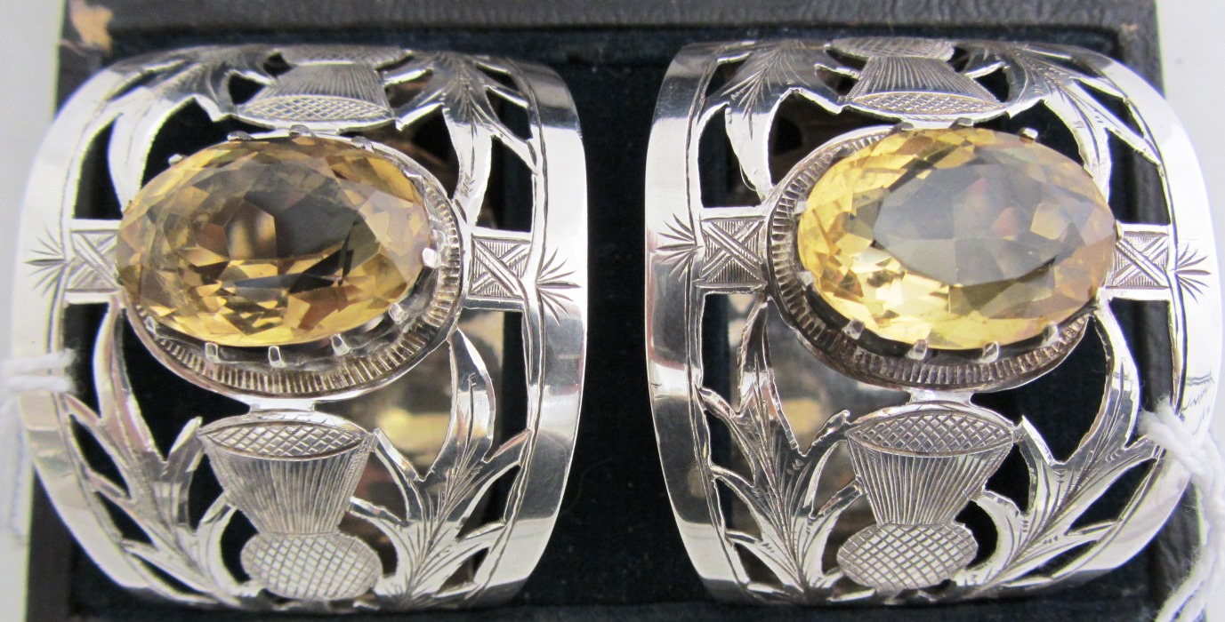 Appraisal: A pair of silver and citrine set napkin rings each