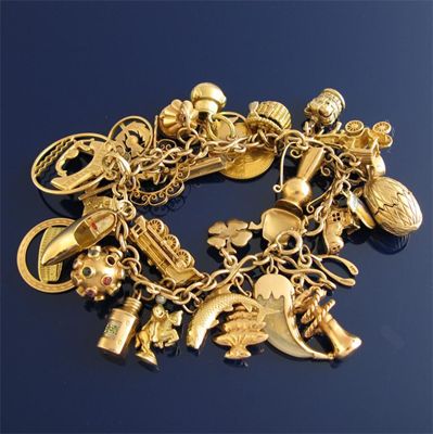 Appraisal: A ct gold fancy link bracelet with charms including a