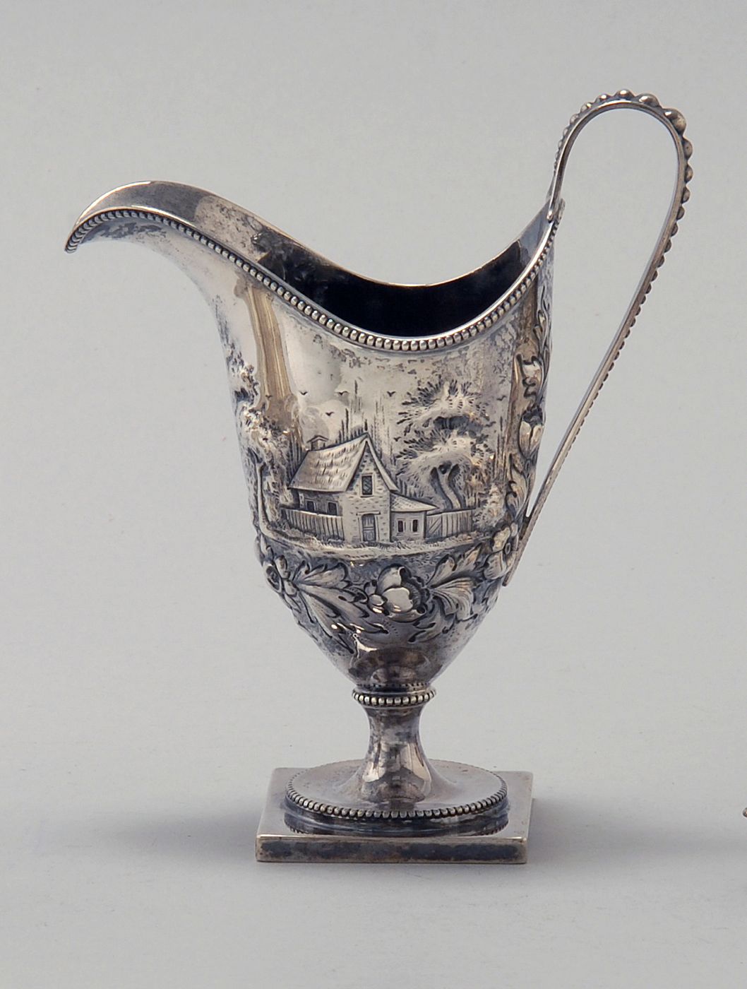 Appraisal: AMERICAN STERLING SILVER HELMET-FORM CREAMER Circa With wonderful chased design