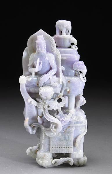 Appraisal: A mottled lavender and green jadeite table sculpture Depicting Buddha