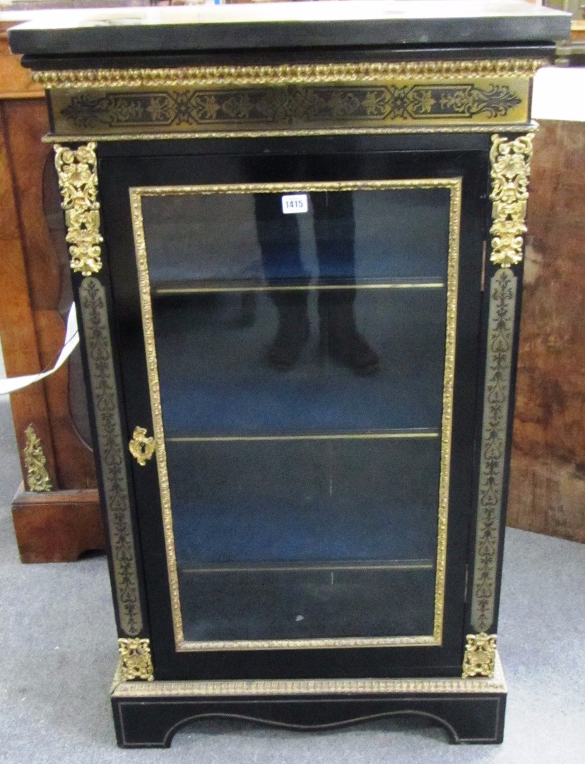 Appraisal: A Victorian brass inlaid single door pier cabinet on plinth