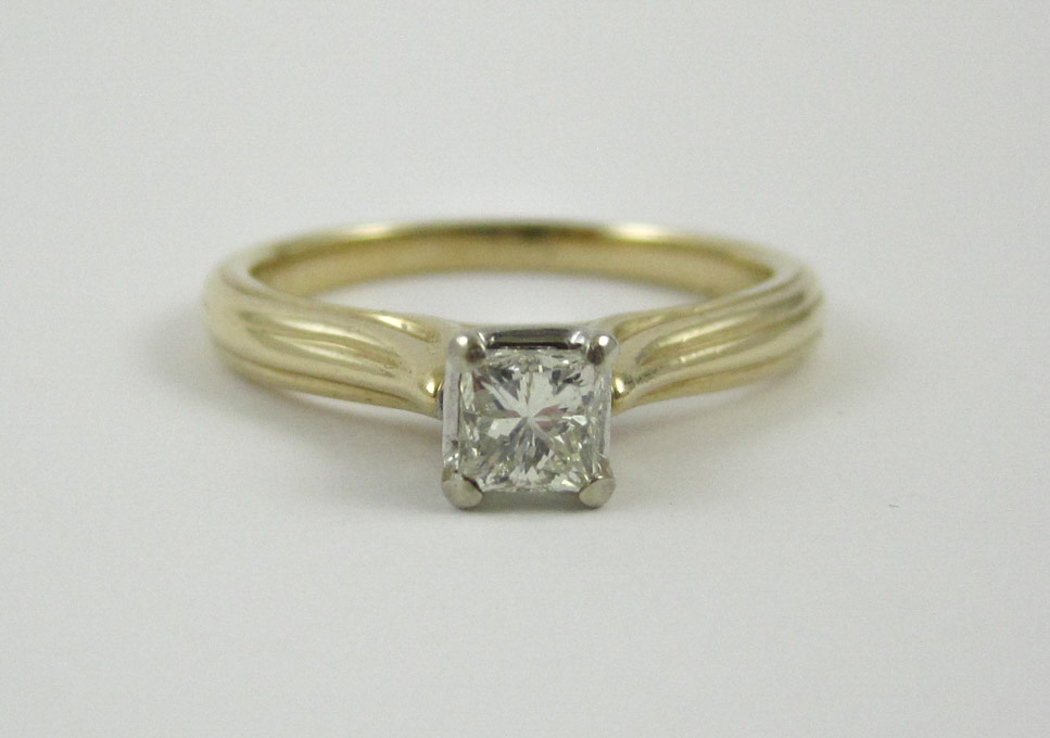 Appraisal: DIAMOND AND FOURTEEN KARAT GOLD SOLITAIRE RING set with a