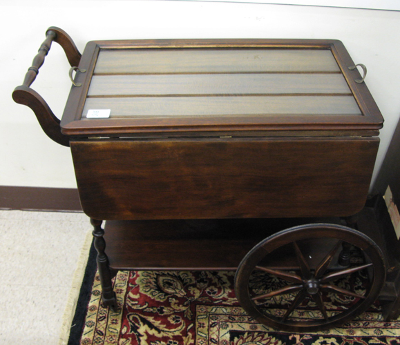 Appraisal: MAHOGANY SERVING CART American c 's the rectangular drop-leaf top