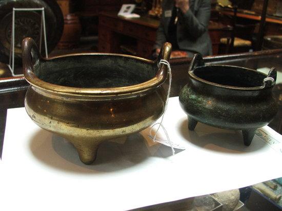 Appraisal: AN EARLY CHINESE BRONZE TWO HANDLED CENSER of oblate two