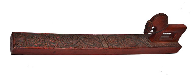 Appraisal: A SCANDINAVIAN RED AND BLACK PAINTED HANGING BOARD with carved