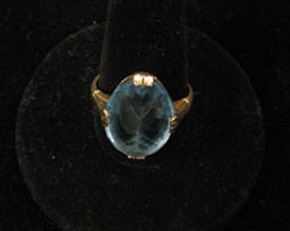 Appraisal: Blue topaz and yellow gold ring Reverse set blue topaz