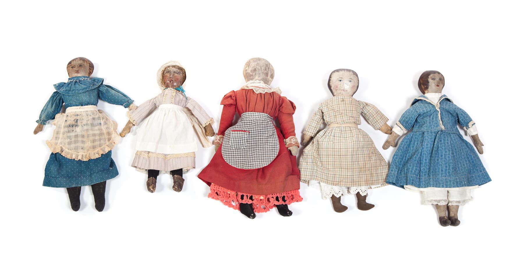 Appraisal: FIVE CLOTH DOLLS WITH OIL PAINTED FACES American mid to