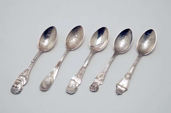 Appraisal: Five silverplated souvenir spoons with figural handles one each of