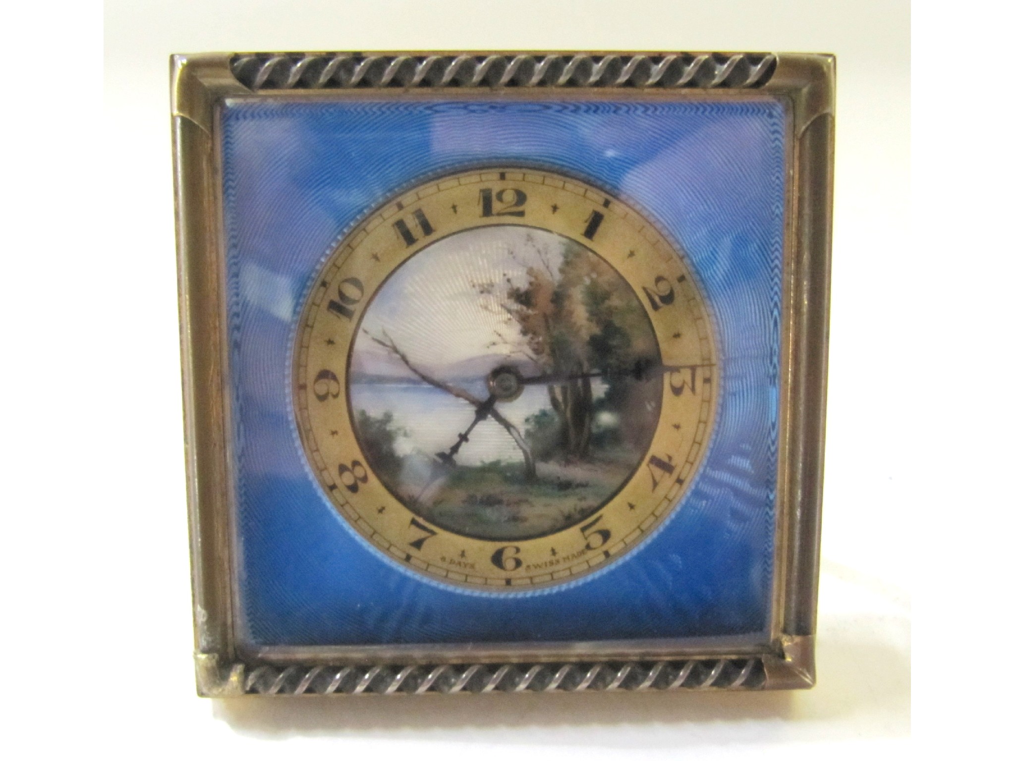 Appraisal: A Swiss travel clock with blue enamelled dial the gilt