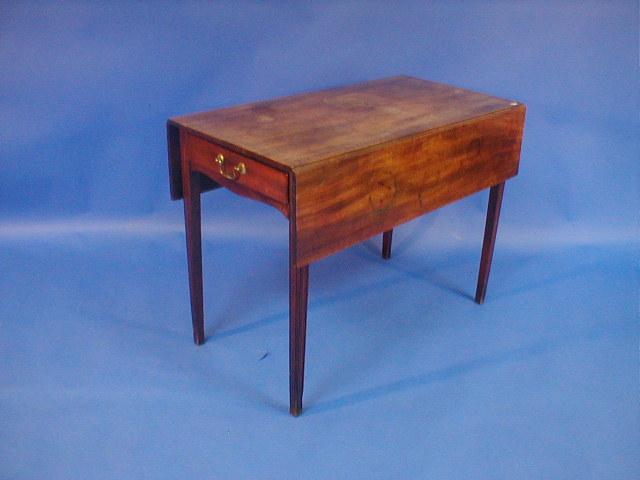 Appraisal: A George III mahogany Pembroke table with moulded square taper