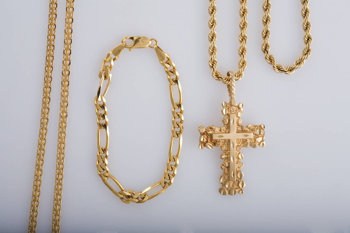 Appraisal: GROUP OF GOLD JEWELRY INCLUDING A CROSS AND A BRACELET