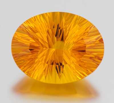 Appraisal: An Unmounted Golden Citrine Gemstone Oval concave cut citrine of