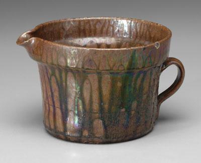 Appraisal: Georgia pitcher flowerpot style with runny dark brown glaze with