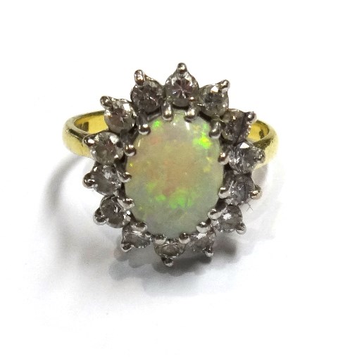 Appraisal: An ct gold opal and diamond set oval cluster ring