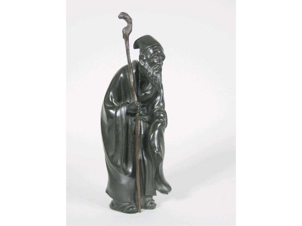 Appraisal: A Japanese bronze Figure of standing bearded sage holding staff