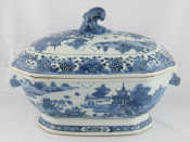 Appraisal: A blue and white stoneware tureen and cover the handles