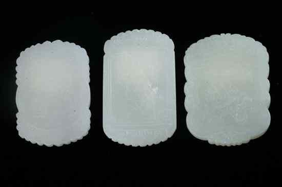 Appraisal: THREE CHINESE CELADON JADE PENDANTS Carved to depict children at