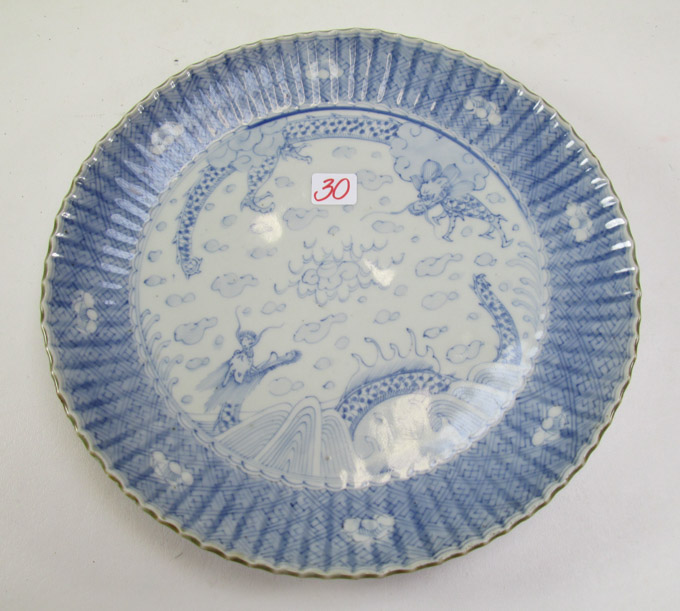 Appraisal: CHINESE BLUE AND WHITE PORCELAIN ROUND PLATTER having two fierce