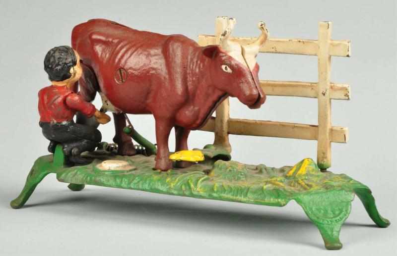 Appraisal: Cast Iron Milking Cow Mechanical Bank Description Circa s Manufactured