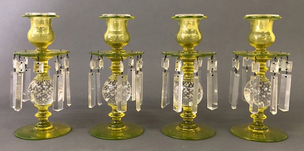 Appraisal: Four Yellow Pairpoint Glass Candlesticks Four yellow Pairpoint glass candlesticks