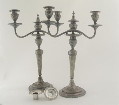 Appraisal: A pair of late Victorian plated three-light candleabra with round