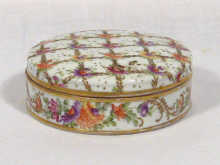 Appraisal: A French circular trinket box decorated with hand painted flowers