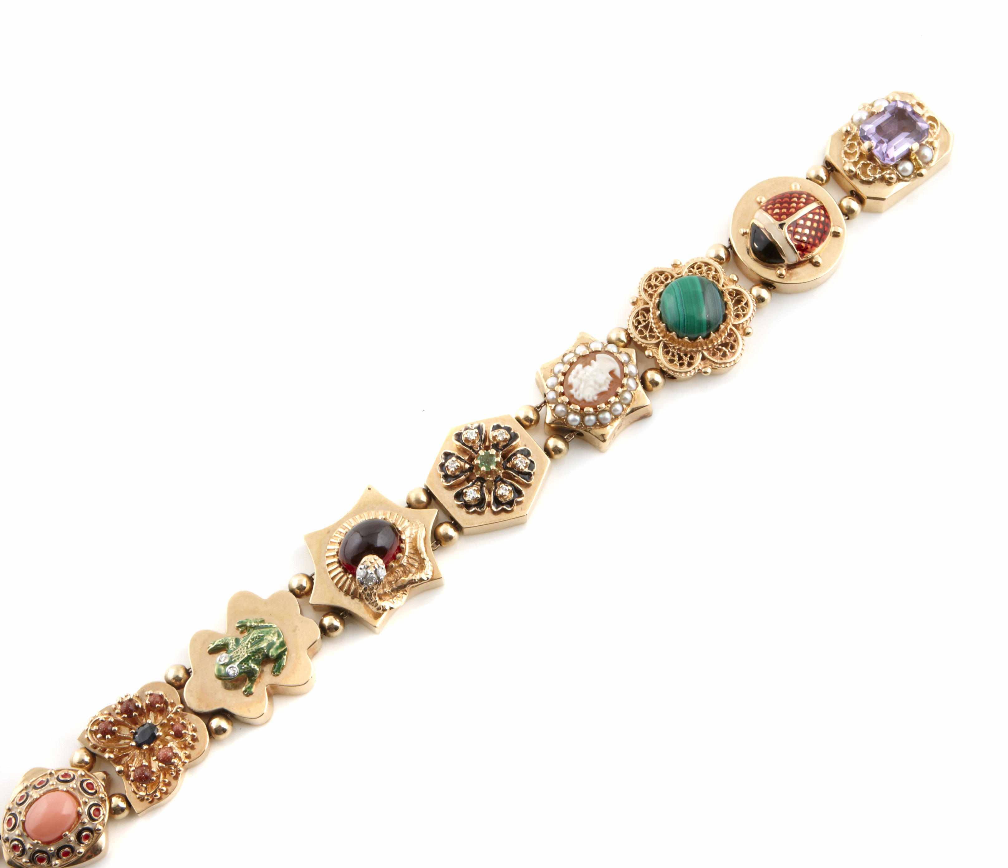 Appraisal: An enamel and gem-set slide bracelet nine slides of various