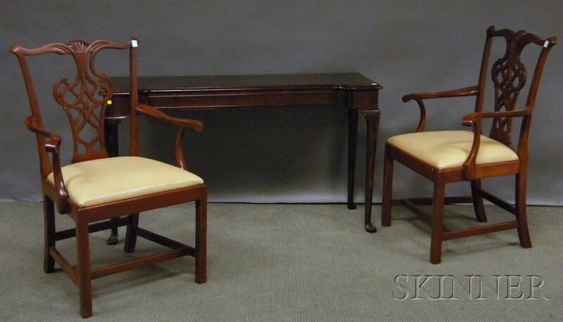 Appraisal: Pair of Chippendale-style Carved Mahogany Armchairs and a Wellington Hall