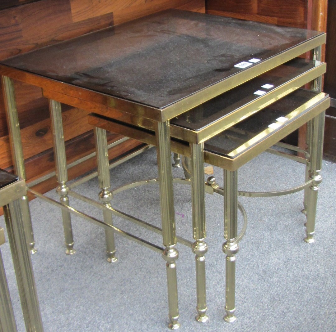 Appraisal: A nest of three th century lacquered brass occasional tables