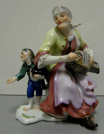 Appraisal: MEISSEN PORCELAIN FIGURE GROUP Woman playing an instrument and a