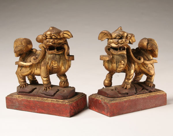 Appraisal: Pair hand carved foo dogs ferocious gilt beasts on painted