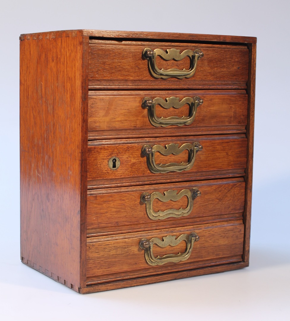 Appraisal: A bank of five Edwardian oak drawers each with brass