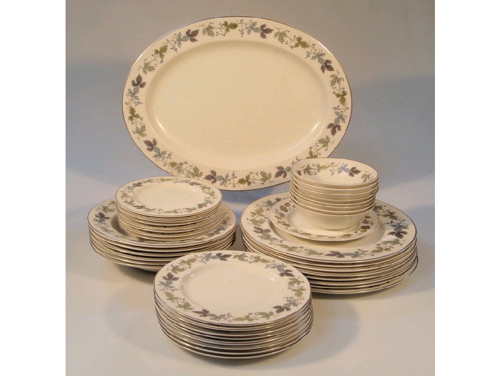 Appraisal: A Royal Doulton Burgundy pattern dinner service comprising oval meat