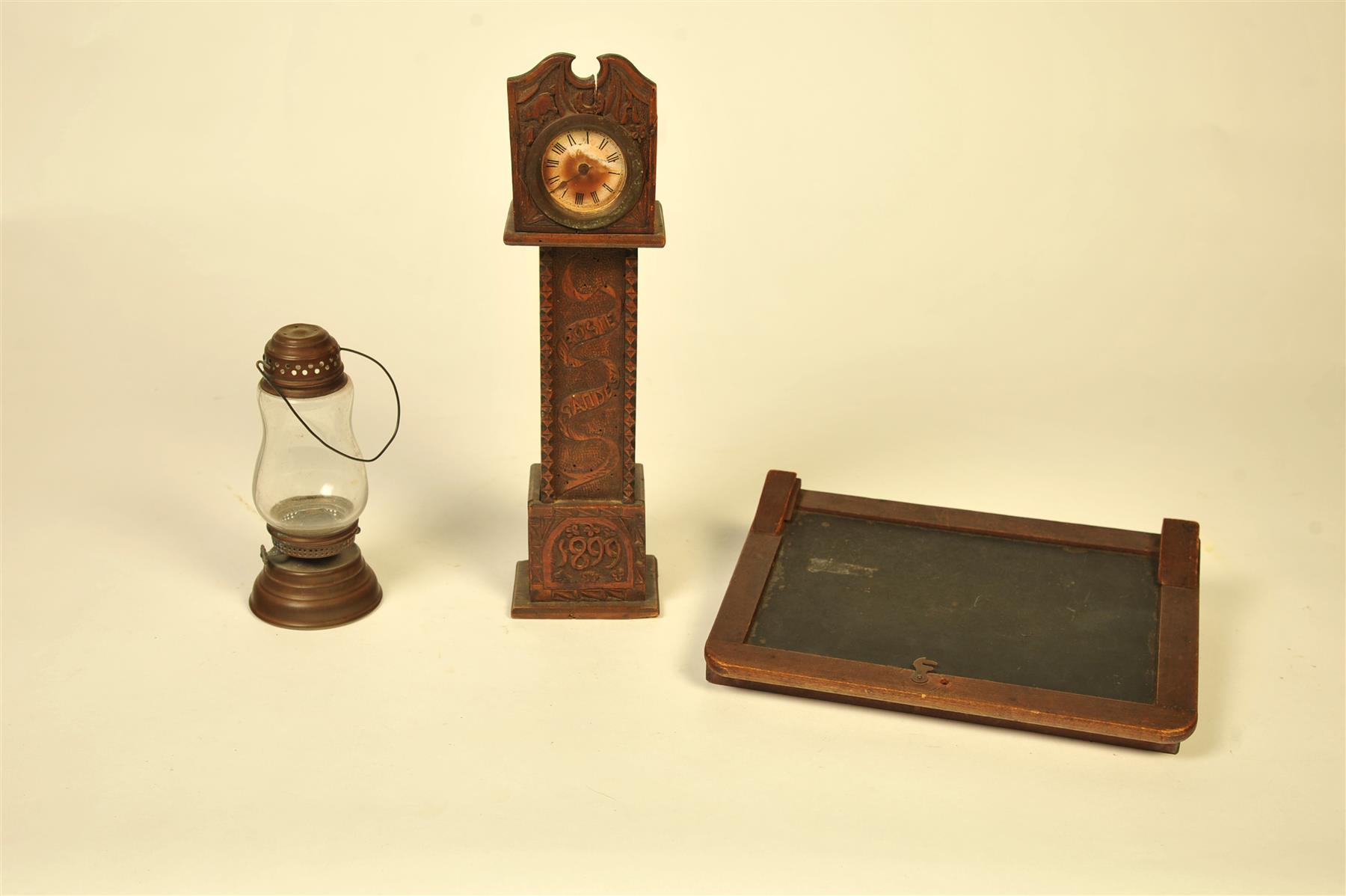 Appraisal: THREE PIECES INCLUDING A CARVED MINIATURE TALLCASE CLOCK SLATE DESK