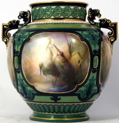 Appraisal: Hadleys Worcester twin handled vase handpainted with panels of Herons