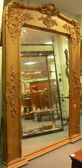 Appraisal: A large Victorian overmantel mirror the arched glass to a