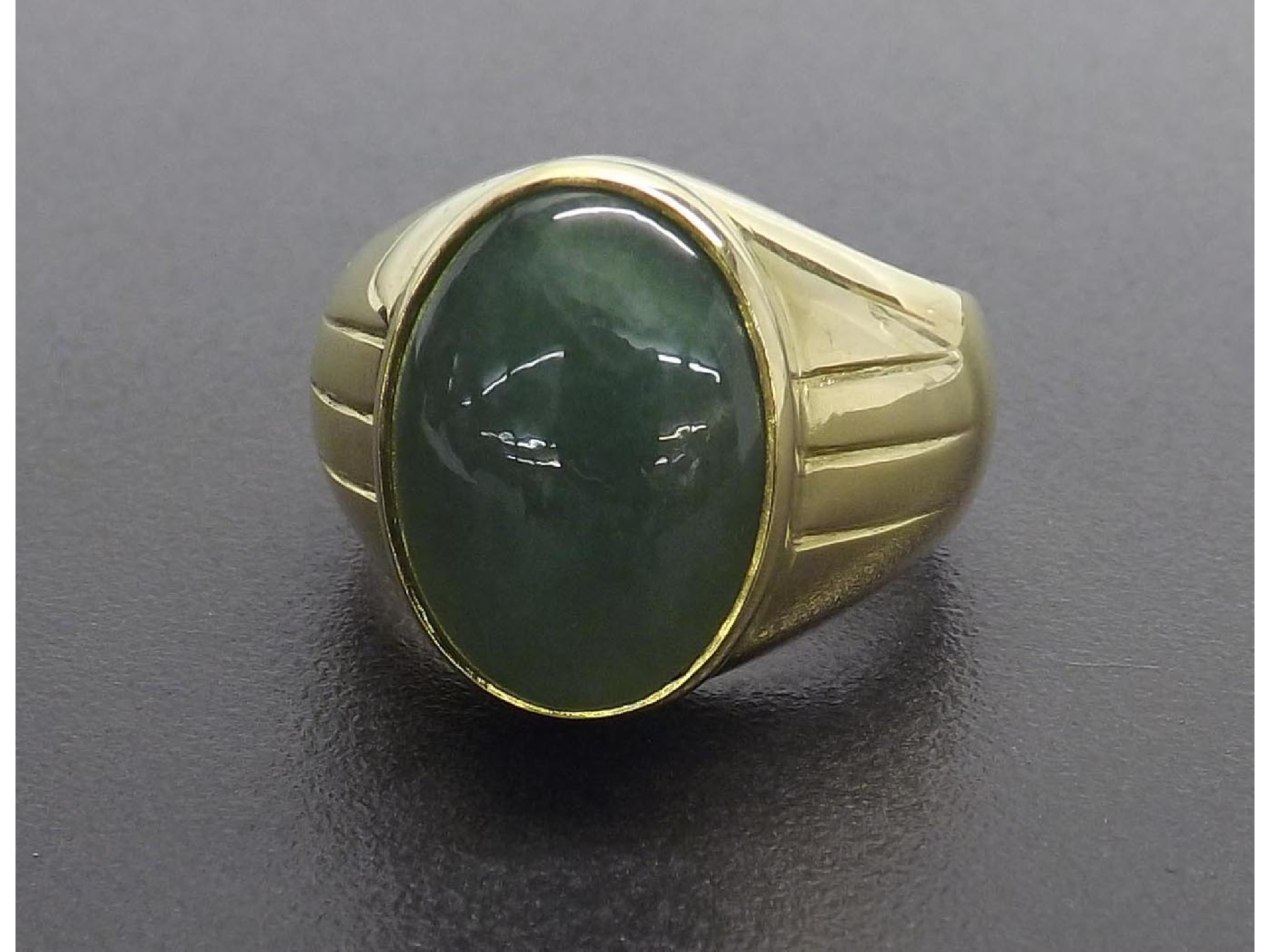 Appraisal: UXJ W Large ct yellow gold jade gentleman's ring cabochon