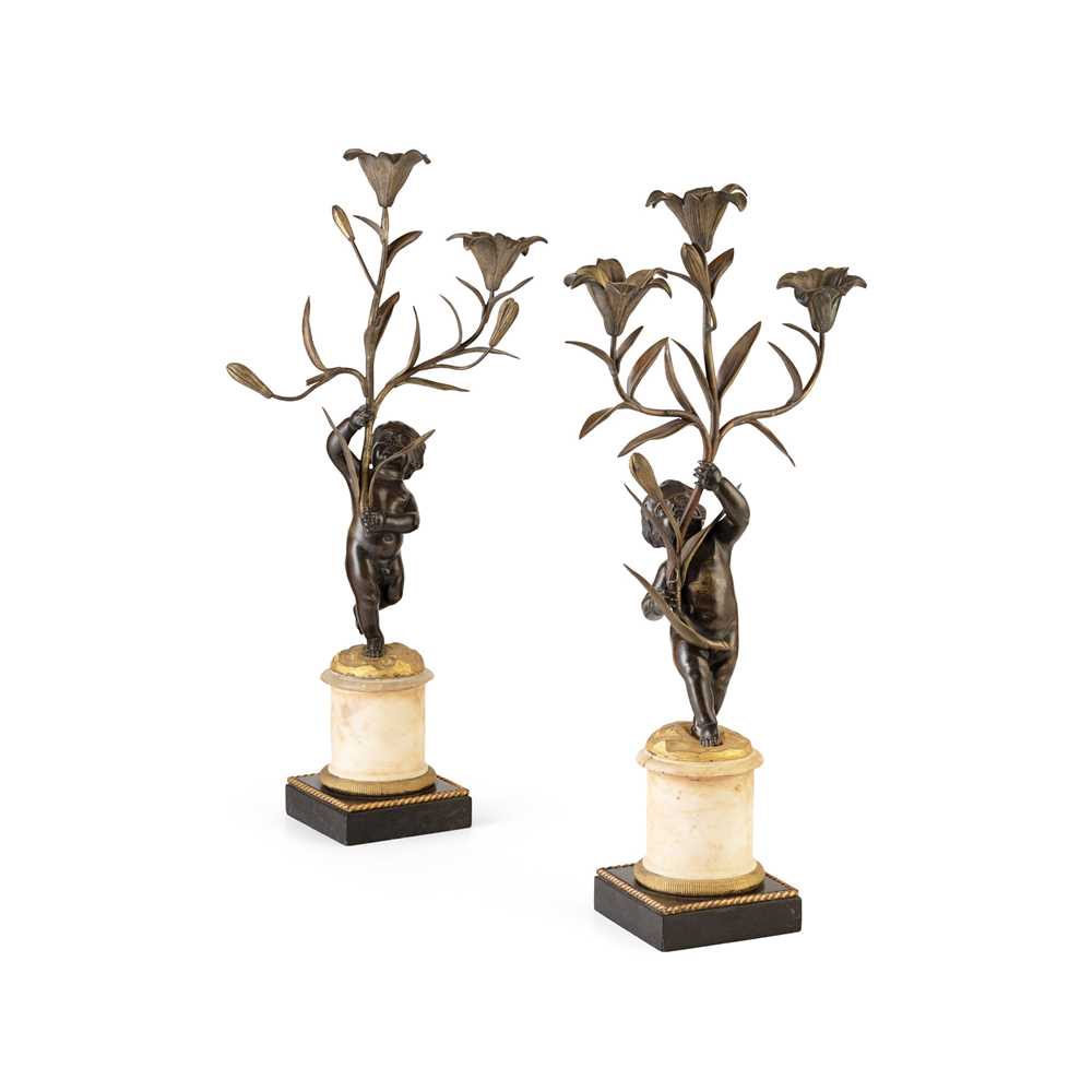 Appraisal: PAIR OF FRENCH PATINATED AND GILT BRONZE FIGURAL CANDELABRA TH