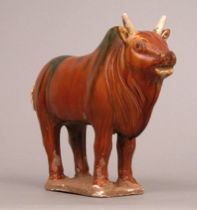 Appraisal: A Glazed Chinese Bull In the Tang style light earthenware