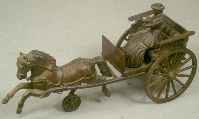 Appraisal: Cast iron toy horse drawn carriage with removable lady driver