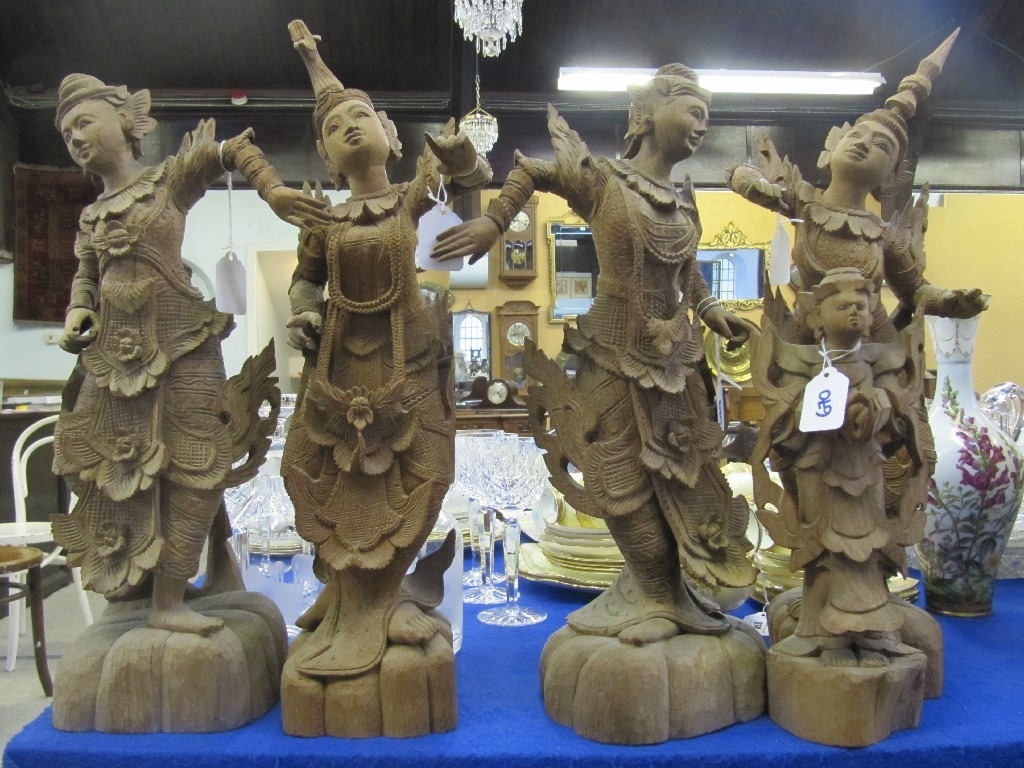 Appraisal: Five carved wooden Thai figures