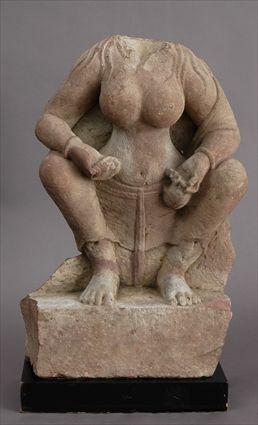 Appraisal: INDIAN CARVED RED SANDSTONE CROUCHING FEMALE FIGURE Half round rendered